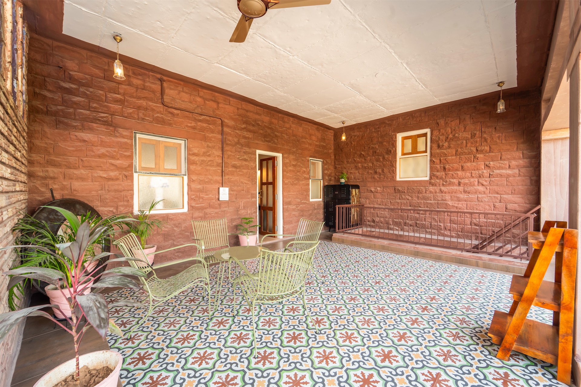 Common terrace with patterned tile and jali screens