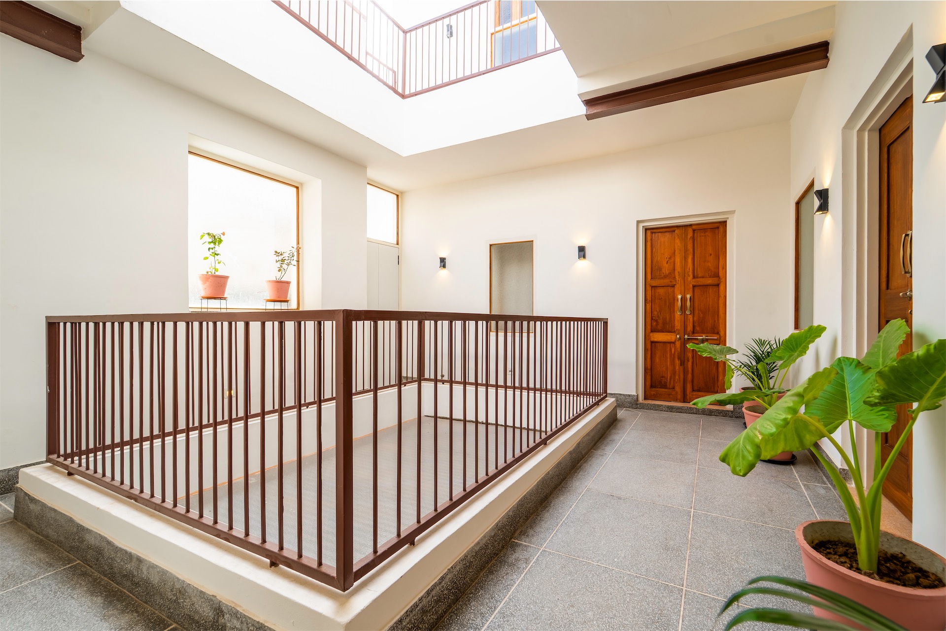 Open courtyard with jali screens and greenery