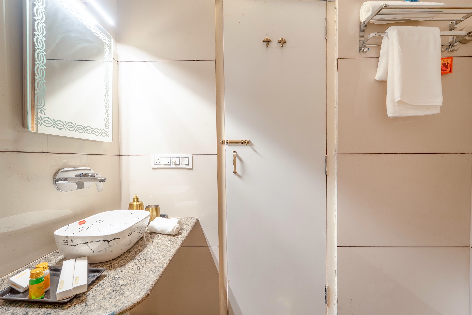 Comfort Suite bathroom — LED mirror and gold accents