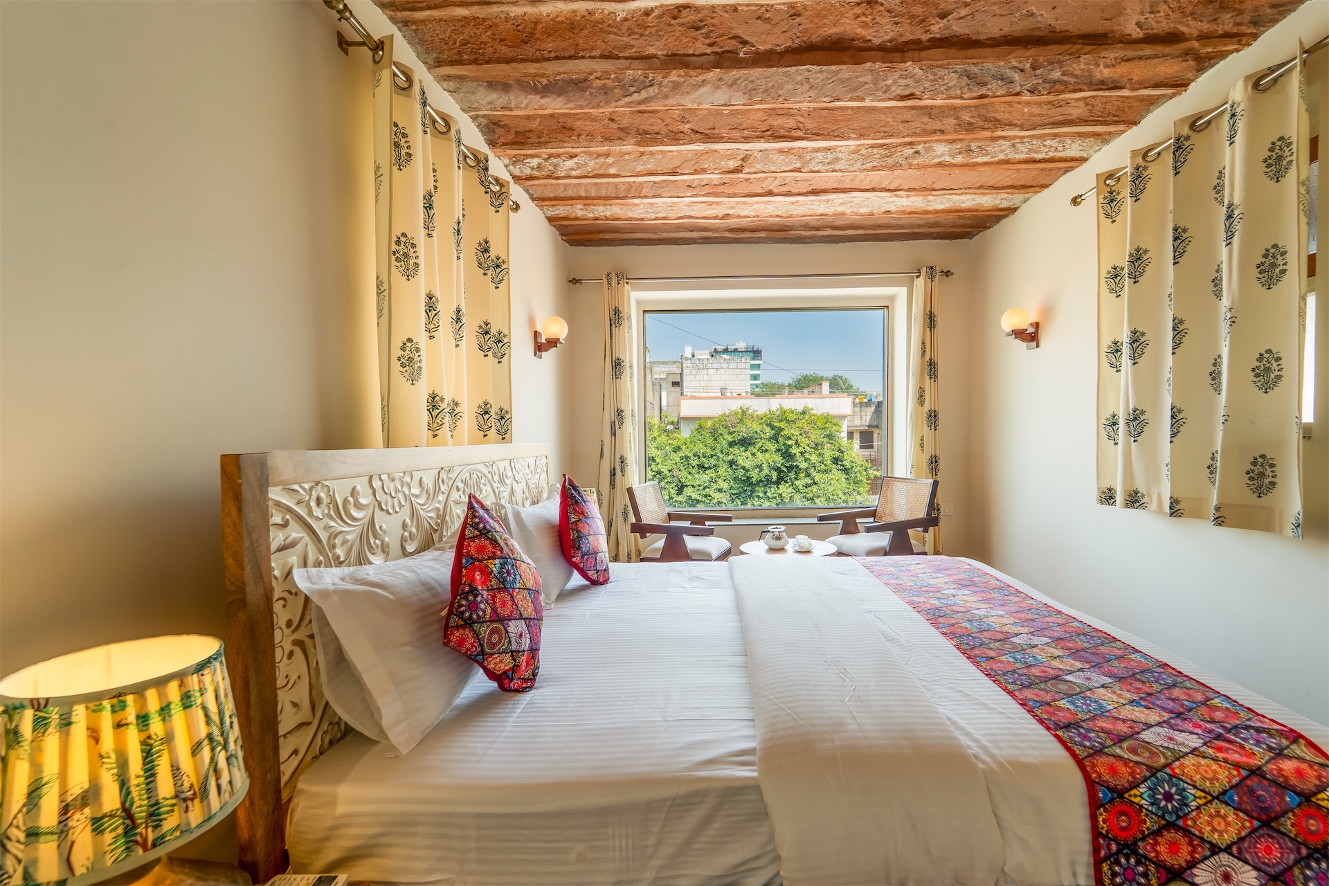 Comfort Suite — bed view with city window